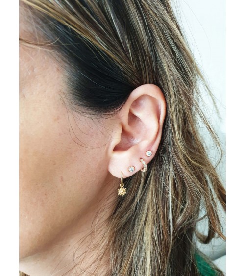 Boucles d'oreilles créoles en plaqué or avec un petit "soleil" pendant
