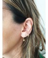 Boucles d'oreilles créoles en plaqué or avec un petit "soleil" pendant