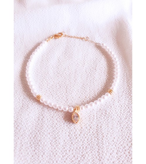 Bracelet en plaqué or avec perles blanches et oxyde de zirconium