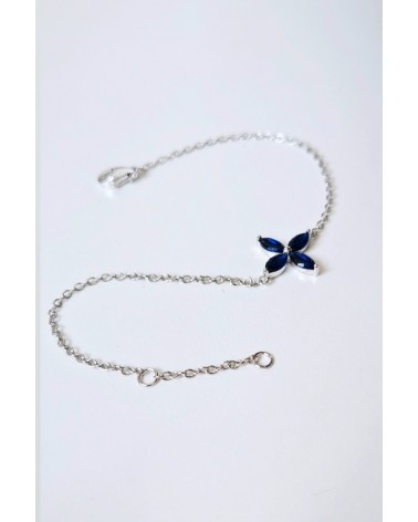 Bracelet "fleur" en argent 925/1000 rhodié et verre couleur bleu saphir