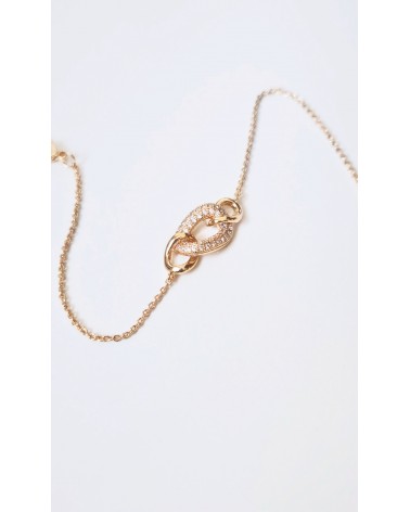 Bracelet en plaqué or avec trois maillons ovales entrelacés dont un avec oxyde de zirconium