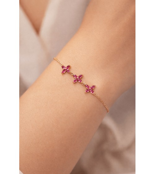 Bracelet en plaqué or et trio de fleurs en verre couleur fuchsia