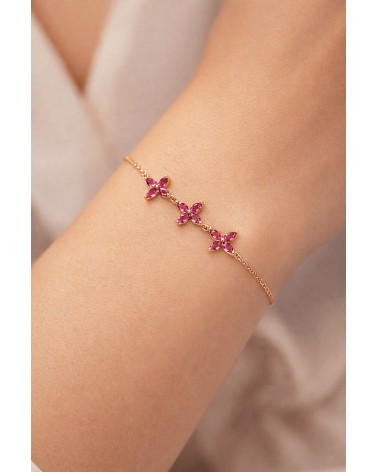 Bracelet en plaqué or et trio de fleurs en verre couleur fuchsia