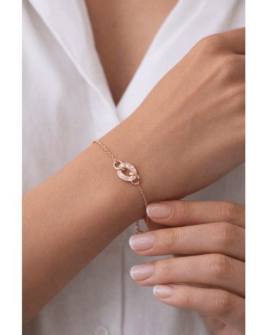 Bracelet en plaqué or avec trois maillons ovales entrelacés dont un avec oxyde de zirconium