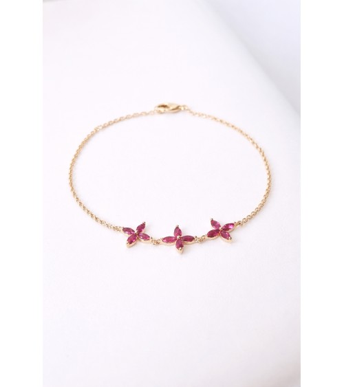 Bracelet en plaqué or et trio de fleurs en verre couleur fuchsia