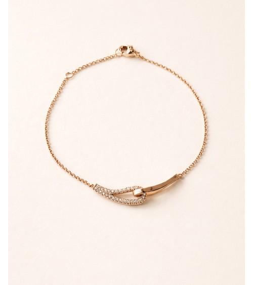 Bracelet forme double goutte en plaqué or, l'une lisse, l'autre sertie d'oxydes de zirconium