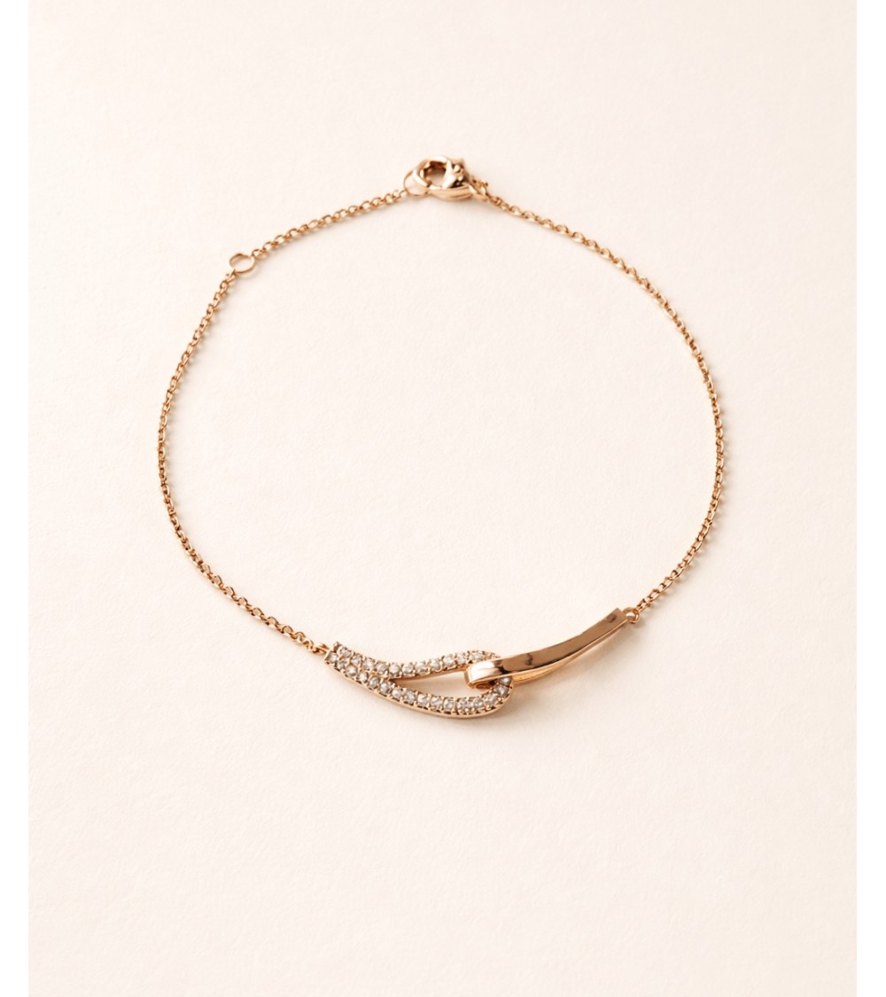 Bracelet forme double goutte en plaqué or, l'une lisse, l'autre sertie d'oxydes de zirconium