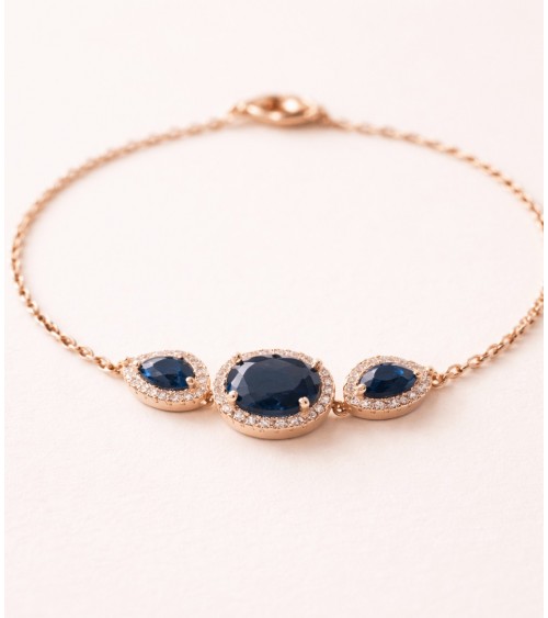 Bracelet en plaqué or avec un ovale et deux gouttes en verre couleur saphir, entourés d'oxydes de zirconium