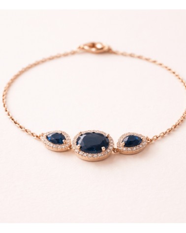 Bracelet en plaqué or avec un ovale et deux gouttes en verre couleur saphir, entourés d'oxydes de zirconium