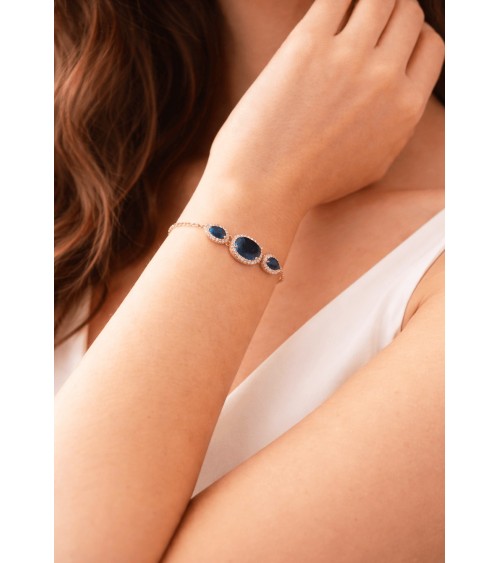 Bracelet en plaqué or avec un ovale et deux gouttes en verre couleur saphir, entourés d'oxydes de zirconium