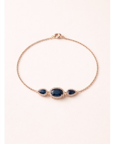 Bracelet en plaqué or avec un ovale et deux gouttes en verre couleur saphir, entourés d'oxydes de zirconium