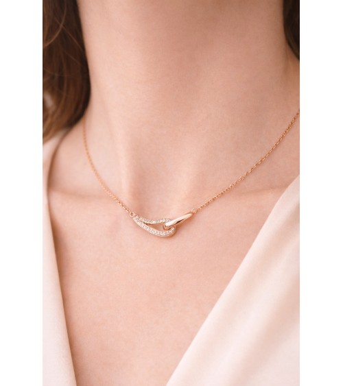 Collier forme double goutte en plaqué or, l'une lisse, l'autre sertie d'oxydes de zirconium