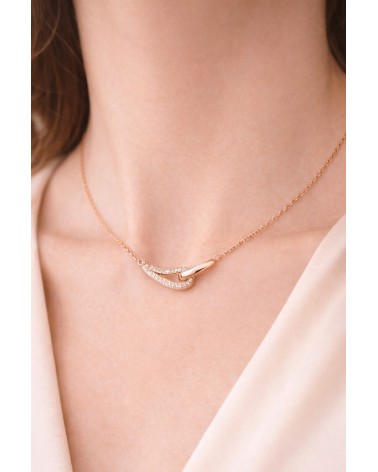 Collier forme double goutte en plaqué or, l'une lisse, l'autre sertie d'oxydes de zirconium