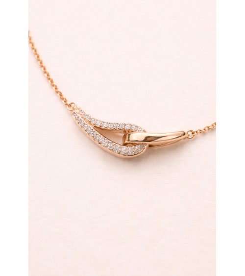 Collier forme double goutte en plaqué or, l'une lisse, l'autre sertie d'oxydes de zirconium