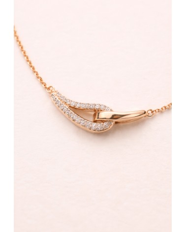 Collier forme double goutte en plaqué or, l'une lisse, l'autre sertie d'oxydes de zirconium