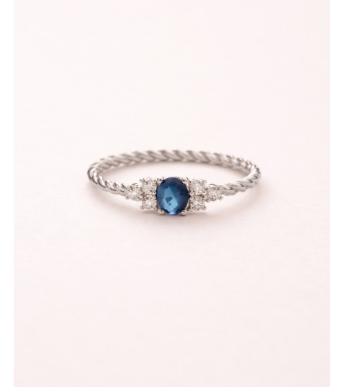 Bague en argent 925/1000ème rhodié avec oxydes de zirconium bleu et blancs et son corps "tressé"