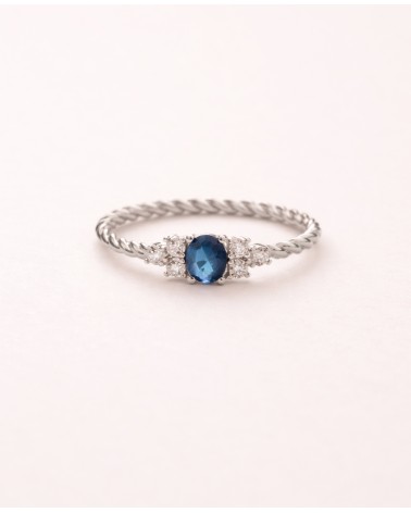 Bague en argent 925/1000ème rhodié avec oxydes de zirconium bleu et blancs et son corps "tressé"