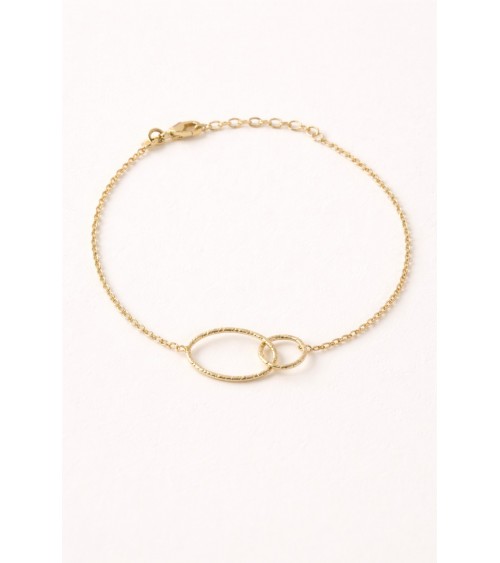 Bracelet en plaqué or avec un anneau ovale et un rond striés entremêlés