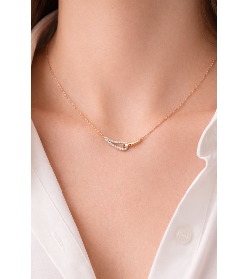 Collier forme double goutte en plaqué or, l'une lisse, l'autre sertie d'oxydes de zirconium