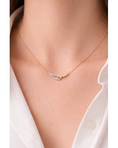 Collier forme double goutte en plaqué or, l'une lisse, l'autre sertie d'oxydes de zirconium