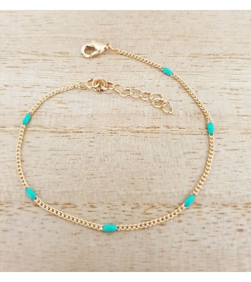 Bracelet en plaqué or avec des petites pierres ovales de couleur turquoise (longueur 19 cm réglable jusqu'à 16 cm)